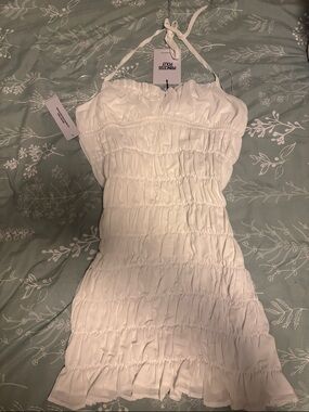 Princess Polly White Smocked Halter Mini Dress with Ruffle Hem. Never Worn
